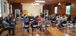 A Taupaki Community Residents and Ratepayers Association meeting in progress at Taupaki Hall